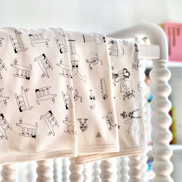 Unisex Organic Cotton Baby Blankets. Natural. The MoMeMans®. Designs by Monica Escobar Allen. Bringing joy to new parenting.