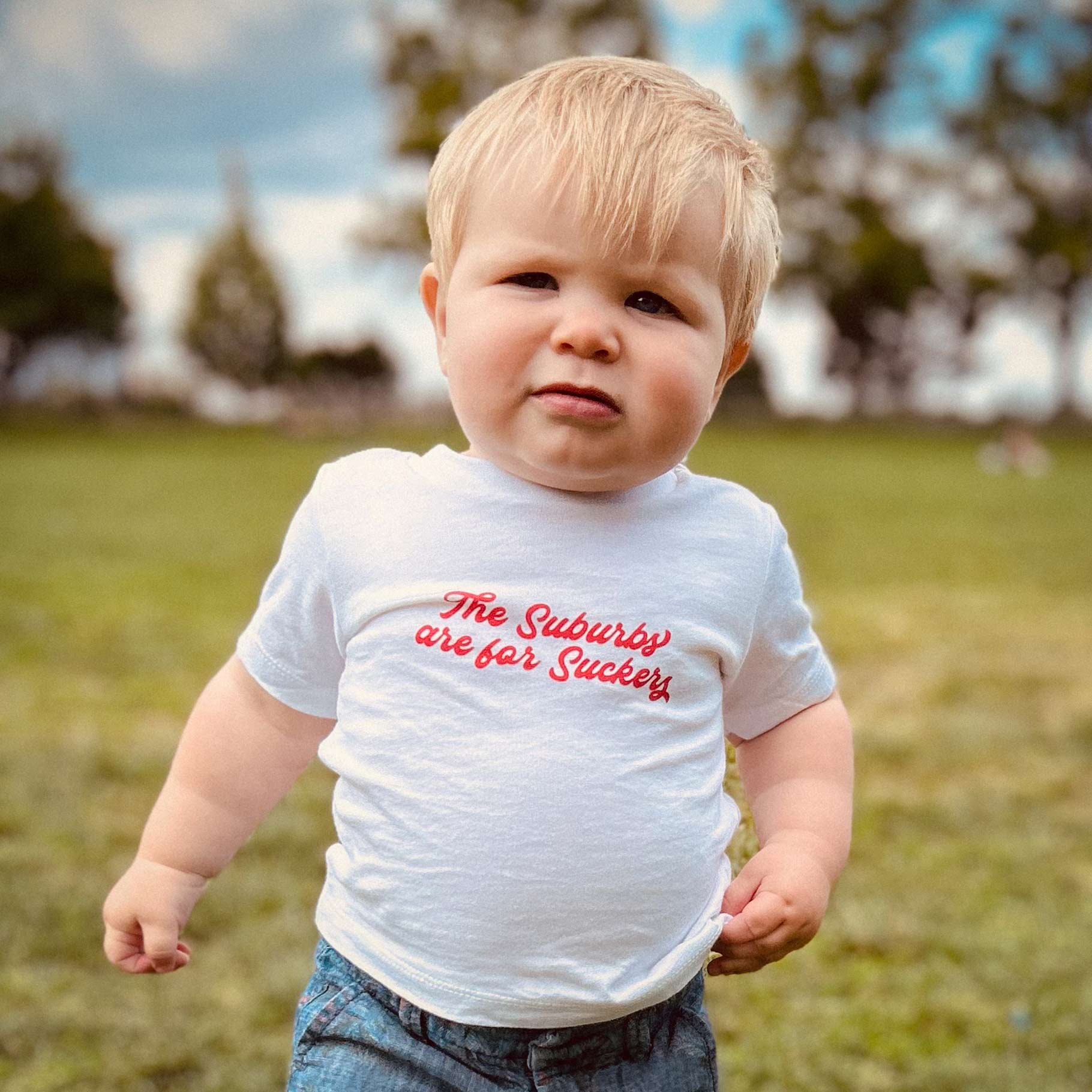 The Suburbs are for Suckers Baby Tee, white | themomemans.com by Monica Escobar Allen