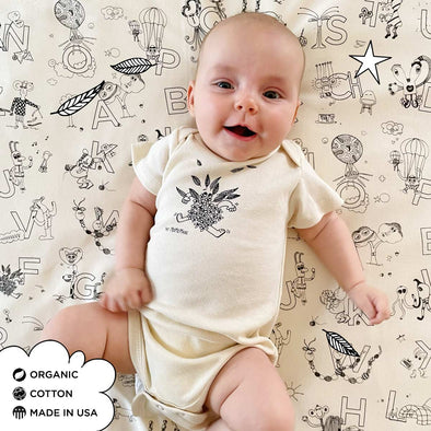Organic Cotton Onesies. Unisex Styles for for the eco-conscious baby registries. The MoMeMans® by Monica Escobar Allen. Small batches made in Brooklyn, NY. Style: Fancy Franny