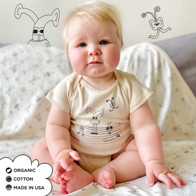 Organic Cotton Onesies. Unisex Styles for for the eco-conscious baby registries. The MoMeMans® by Monica Escobar Allen. Small batches made in Brooklyn, NY. Style: Bots Family